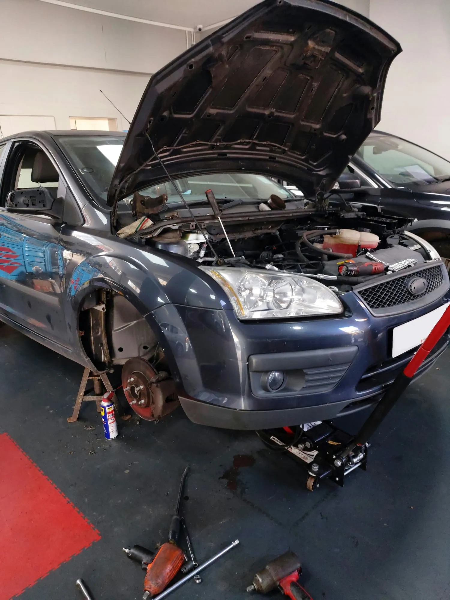 Blue car with bonnet up